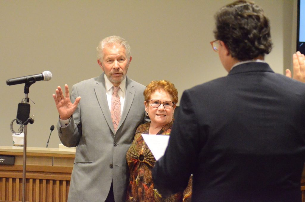 Alderman Robert Basso is joined by his wife, Patricia, in his swearing in ceremony by Palos Heights Clerk Thomas Kantas on May 2. (Photo by Jeff Vorva)
