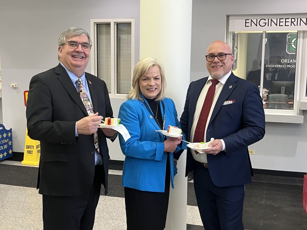 Trustees William Healy (from left), Cynthia Nelson Katsenes and Michael Milani had cake in their honor after they were sworn back into office on May 1. (Photo by Jeff Vorva)