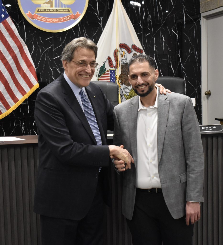 Kalid Baste is congratulated by Mayor Steve Landek after being sworn in as Bridgeview’s first Arab American village trustee. (Photos by Steve Metsch) 