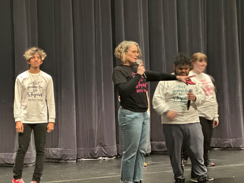 Amy Perras helps her students perform their improv show at Oak Lawn Community High School. (Supplied photo)