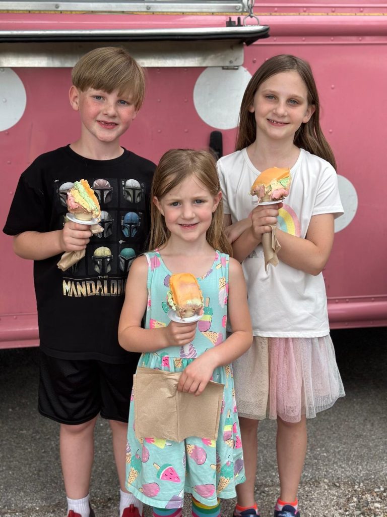 The Vandermolen family, of Palos Hills: Evan, 8; Elyssa, 5; and Evelyn, 10, enjoy Rainbow Cone at the Green Hills Public Library's Summer Reading Kick-off on June 12. (Photos by Kelly White)