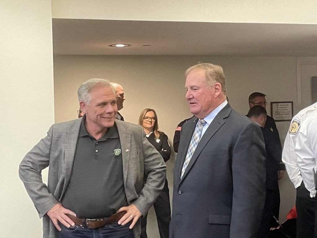 Former Orland Park Police Chief Tim McCarthy (right) and Keith Pekau talk before a meeting in 2022. McCarthy will have the police station named in his honor. (Photo by Jeff Vorva)
