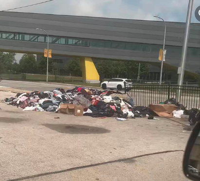 A pile of donated clothes lies untouched on 76th Street, near Ford City East and across the street from Daley College. --Supplied photo